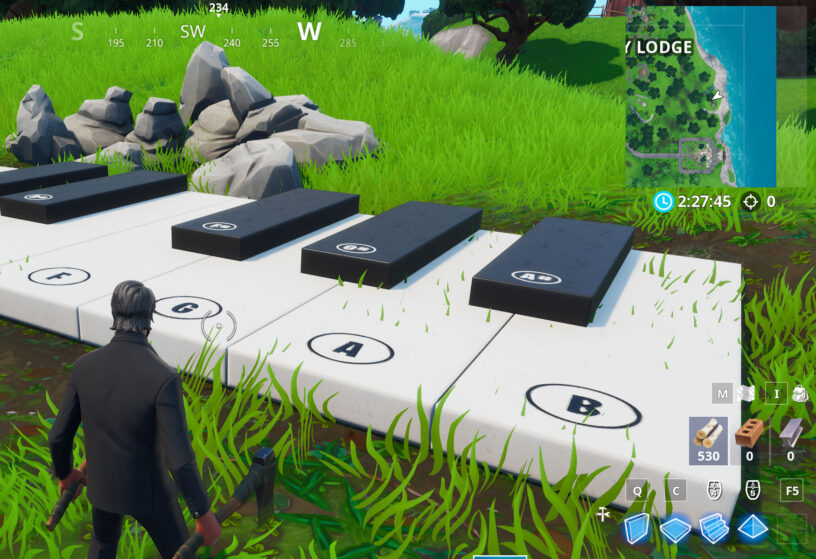 Fortnite Season 9 Visit An Oversized Phone A Big Piano And A Giant Dancing Fish Trophy Locations Pro Game Guides - how to play piano in roblox using a bot