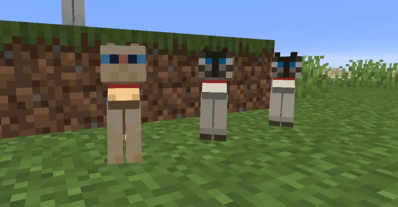 Three tamed cats sitting with collars on in Minecraft