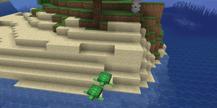 A couple turtles on an island with an Ocean Monument nearby.