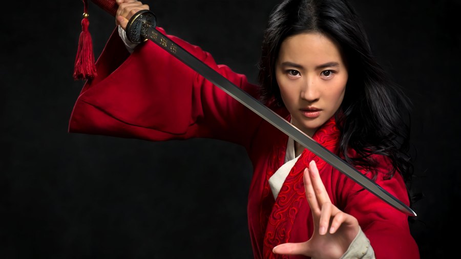 Mulan holding a sword in movie promo