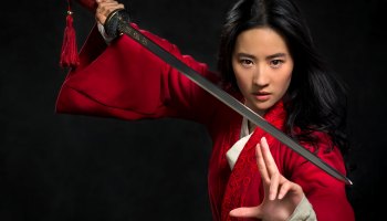 Mulan holding a sword in movie promo