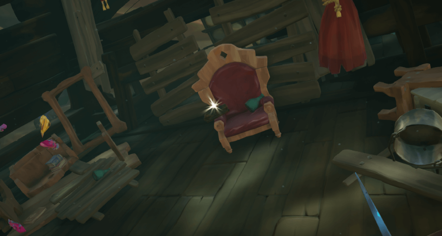 The Magpie's Wing Ship's Log in a chair.
