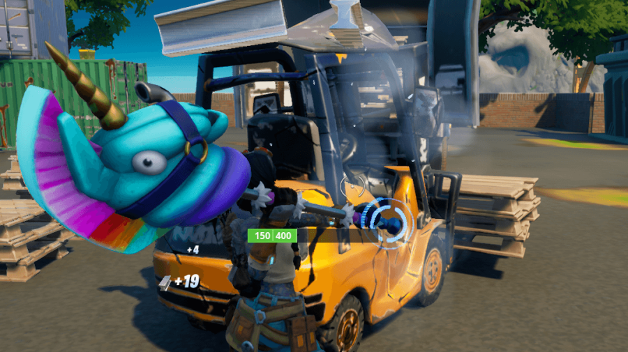 A Fortnite character breaking a forklift for mechanical parts.