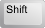 Shift button on Keyboard.