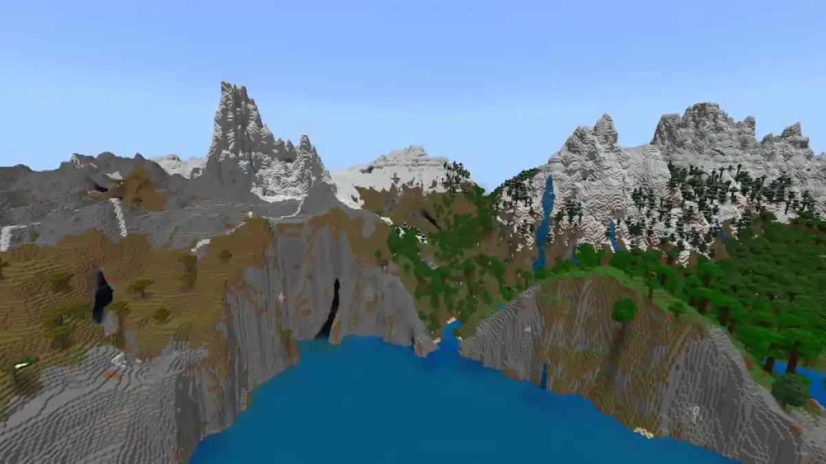 A mountain range towering over the ocean in Minecraft.