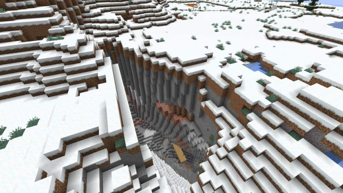 A ravine in a Snowy Plains with a mineshaft at the entrance.