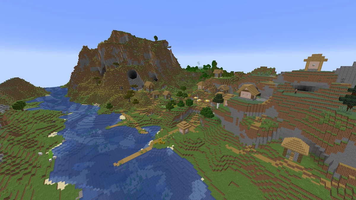 A platformed Plains Village to the right of a mountain riddled with circular tunnels.