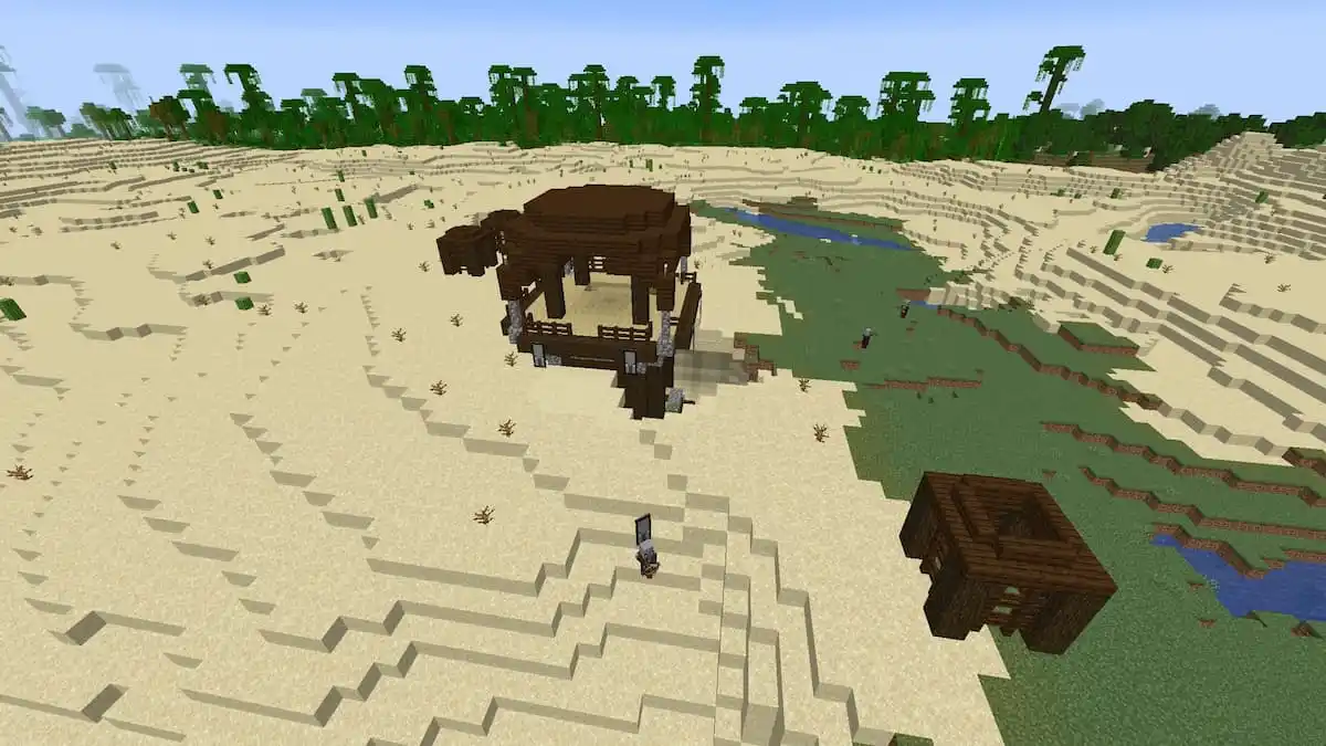 A Pillager Outpost buried in the sand of a Minecraft desert.