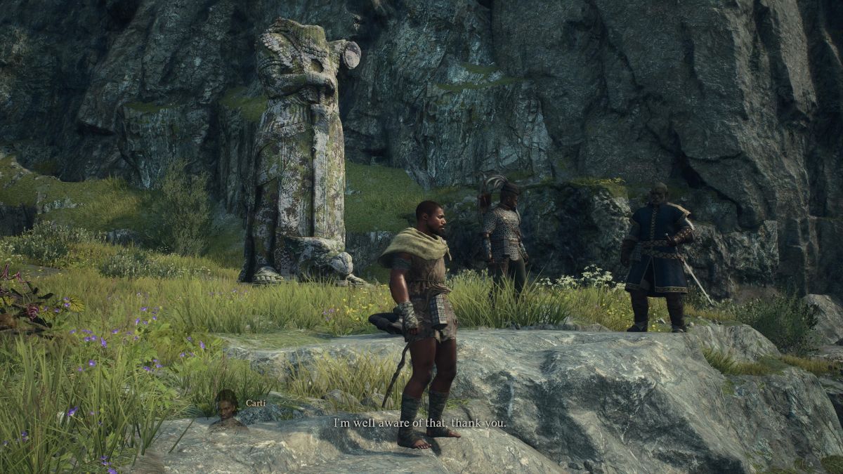 The Arisen stands with his party in front of a beheaded dragon statue