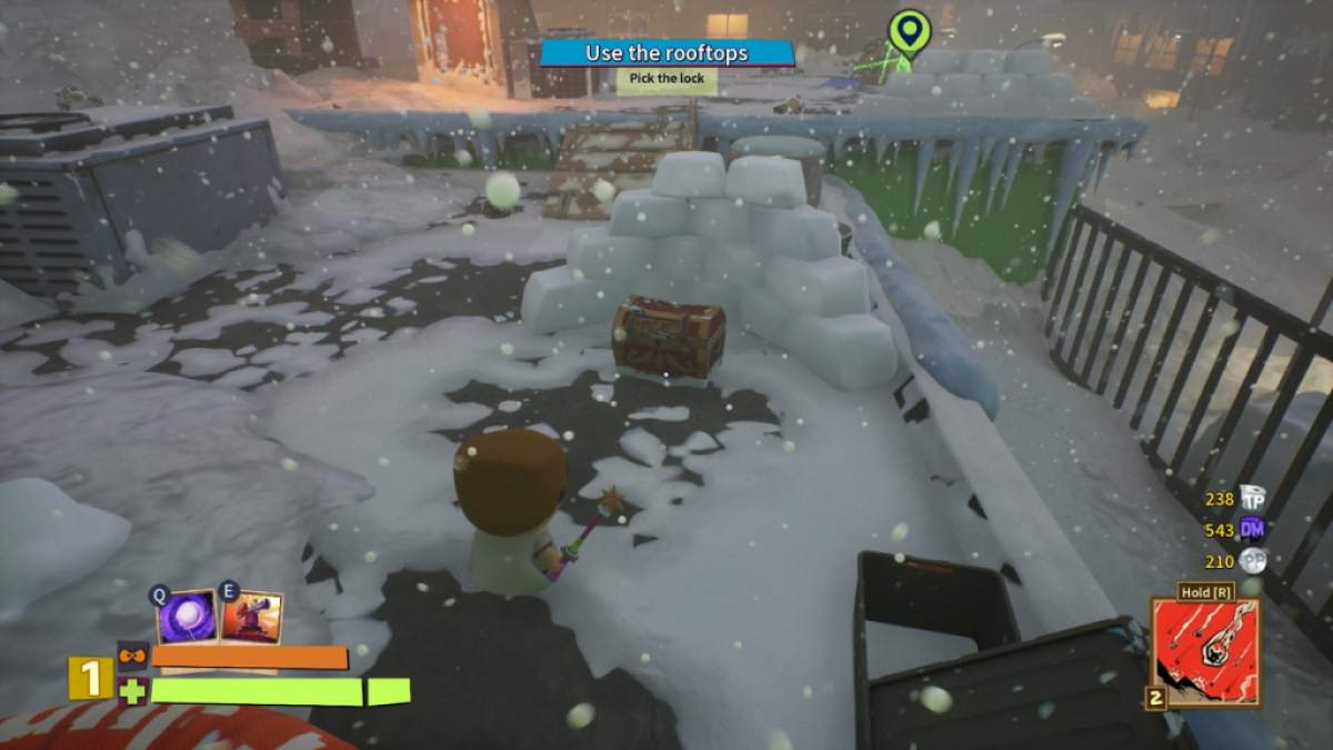 Player looking at a treasure chest behind a fortified snow wall in South Park Snow Day