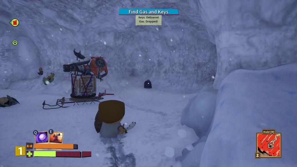 A player looking at a backpack next to a snow turret in a cave in South Park Snow Day