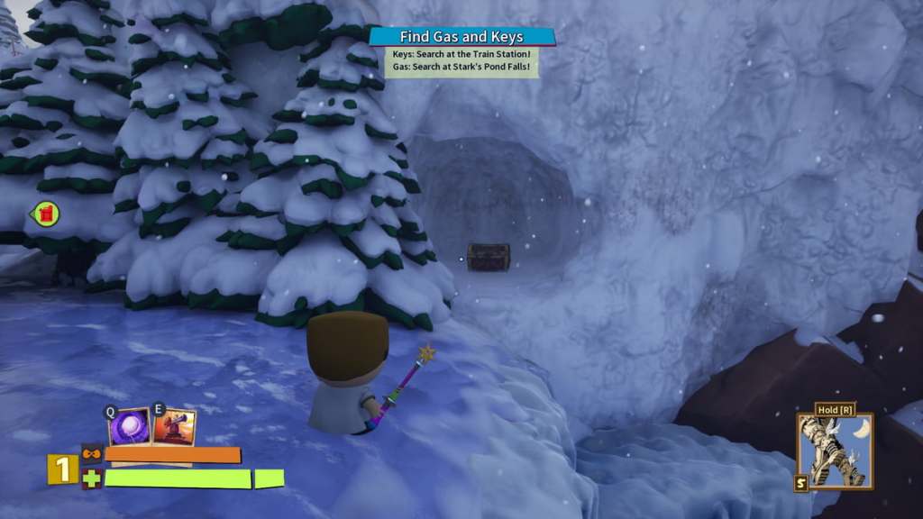 Player standing on the edge of a frozen waterfall looking at a cave containing a treasure chest in South Park Snow Day