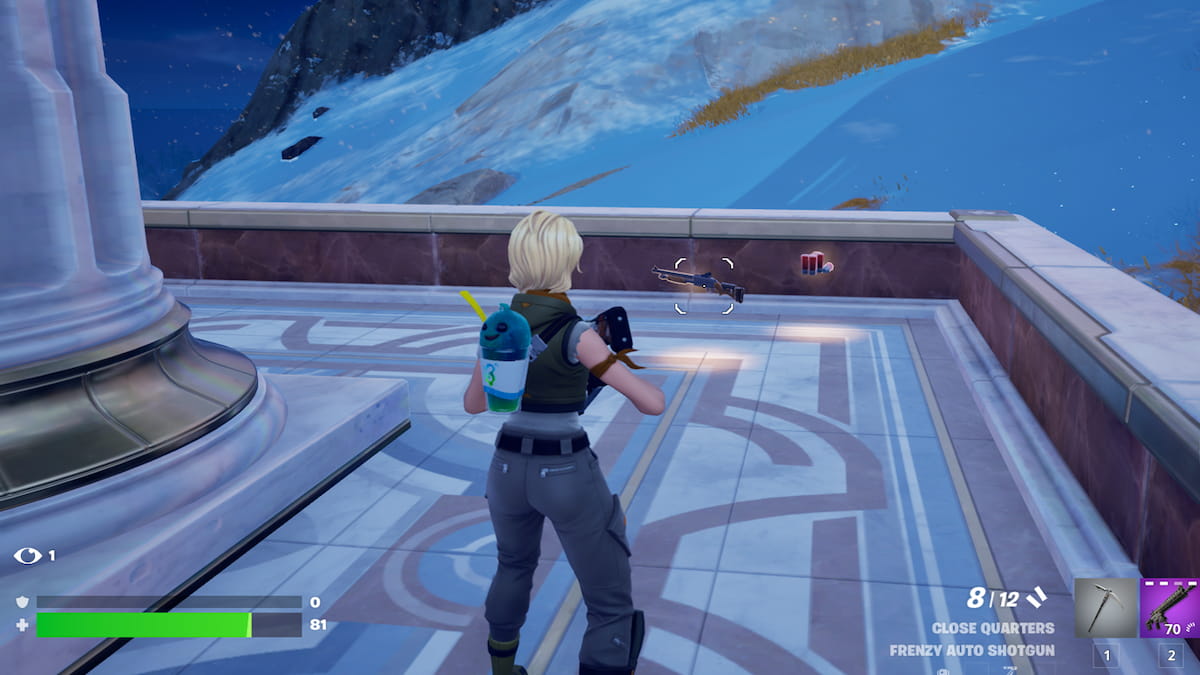 A player standing in front of a weapon in Fortnite