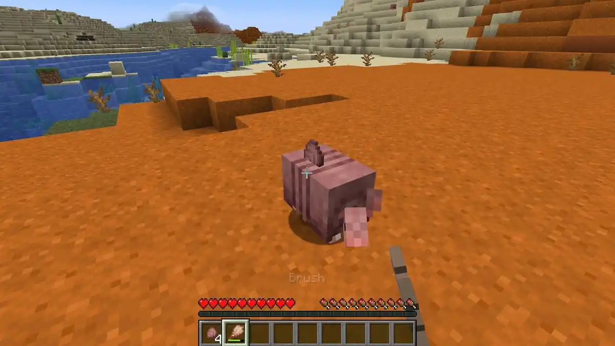 Using a brush on an Armadillo in Minecraft.