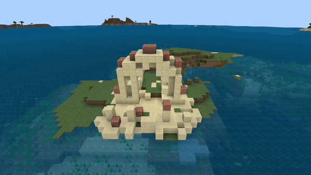 A small grassy island with a Warm Ocean Ruin structure on top of it in Minecraft.