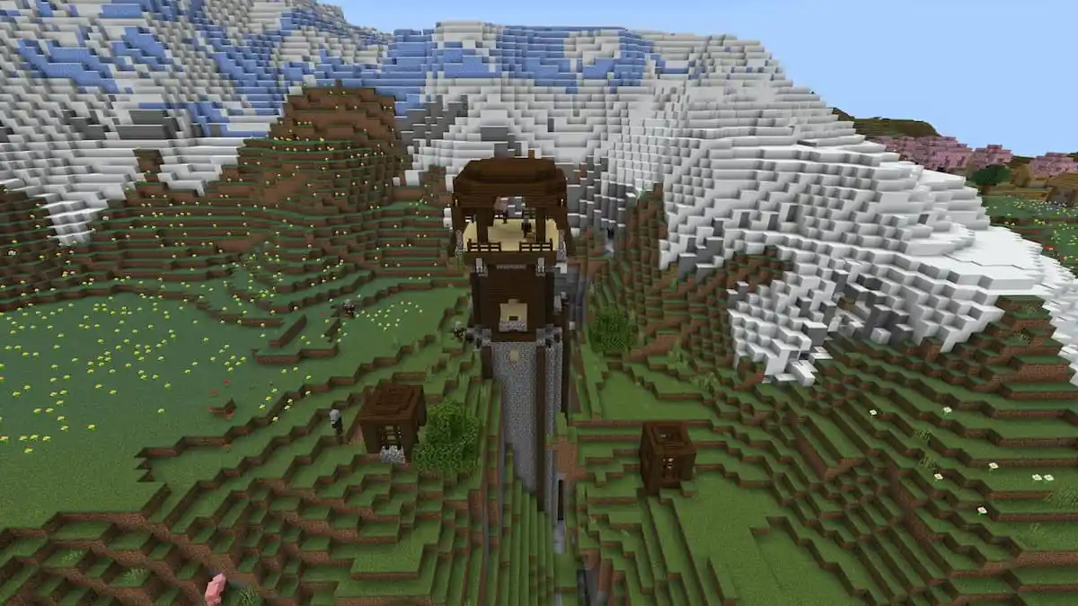 A tall Pillager Outpost coming out of a cave in Minecraft.