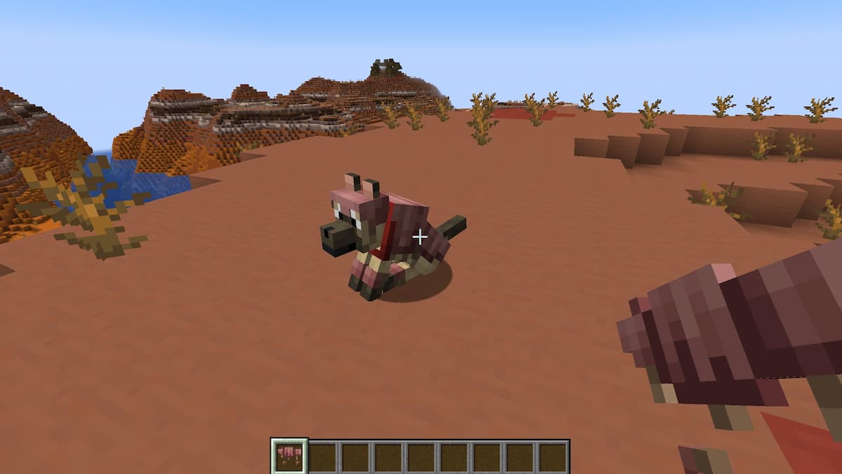 A Minecraft dog wearing Wolf Armor in the Badlands.