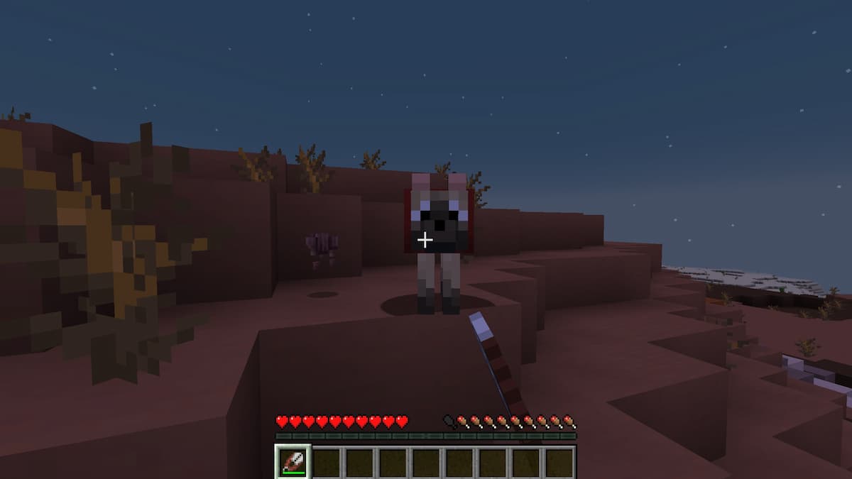 Using Shears to remove Wolf Armor in Minecraft.