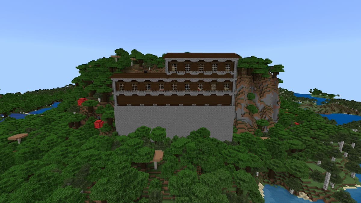 A Woodland Mansion against a Dark Oak hill in Minecraft.