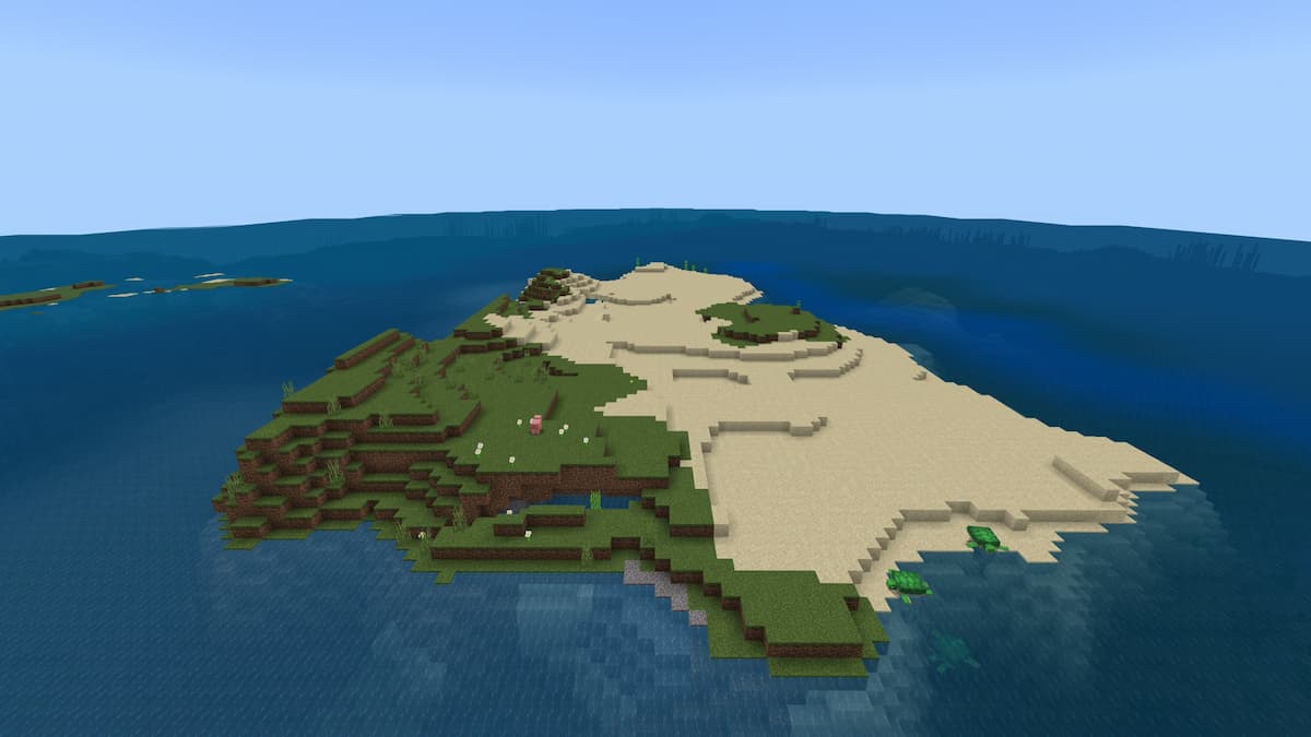 A small Minecraft island with grass and sand.