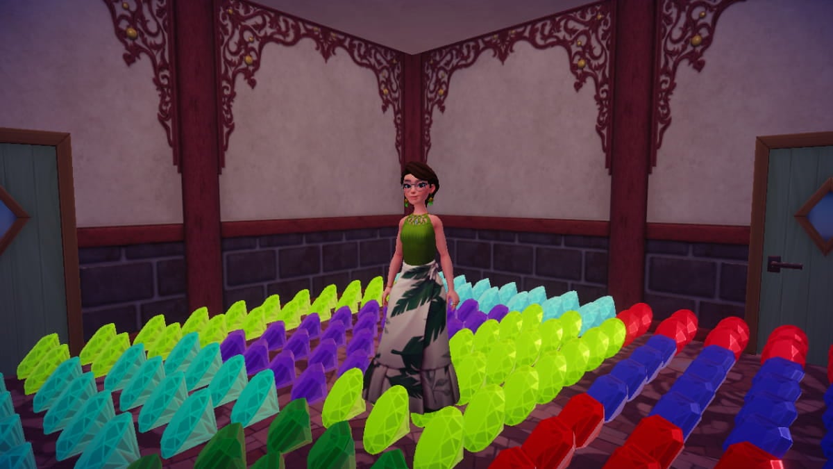 Fem-presenting Disney Dreamlight Valley avatar in a green top and long skirt with a leaf pattern stands in the middle of a collection of gems in a room inside a Disney Dreamlight Valley gift house.