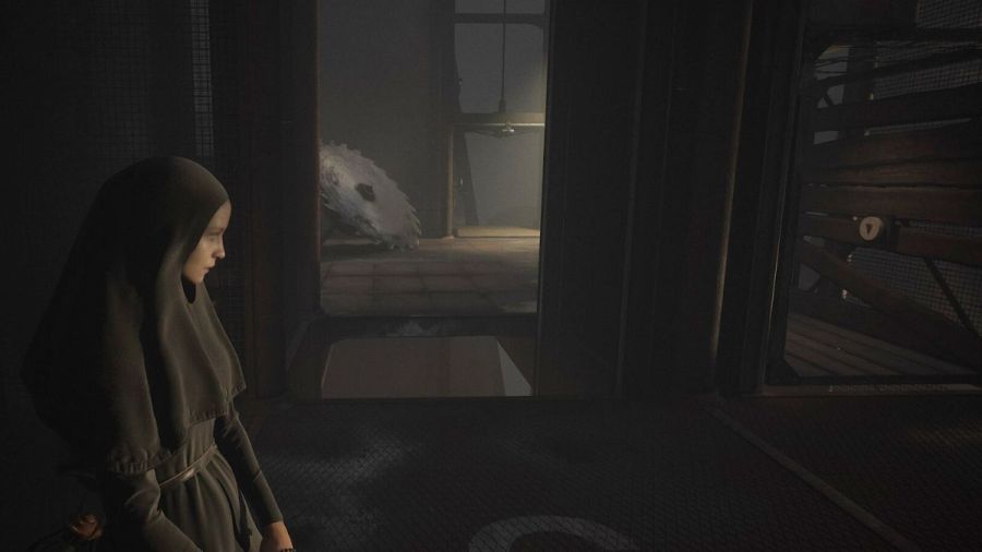 Indika standing in front of the elevator puzzle in INDIKA