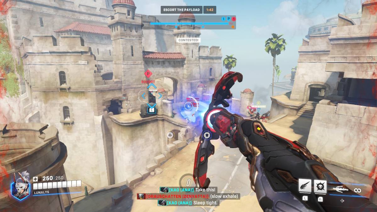A screenshot showing gameplay during the Mirrorwatch event's challenges. The player is using Mercy's new ultimate to shoot at their enemies from the sky. The environment is sandy, full of ruins. Mercy's staff is red and black.