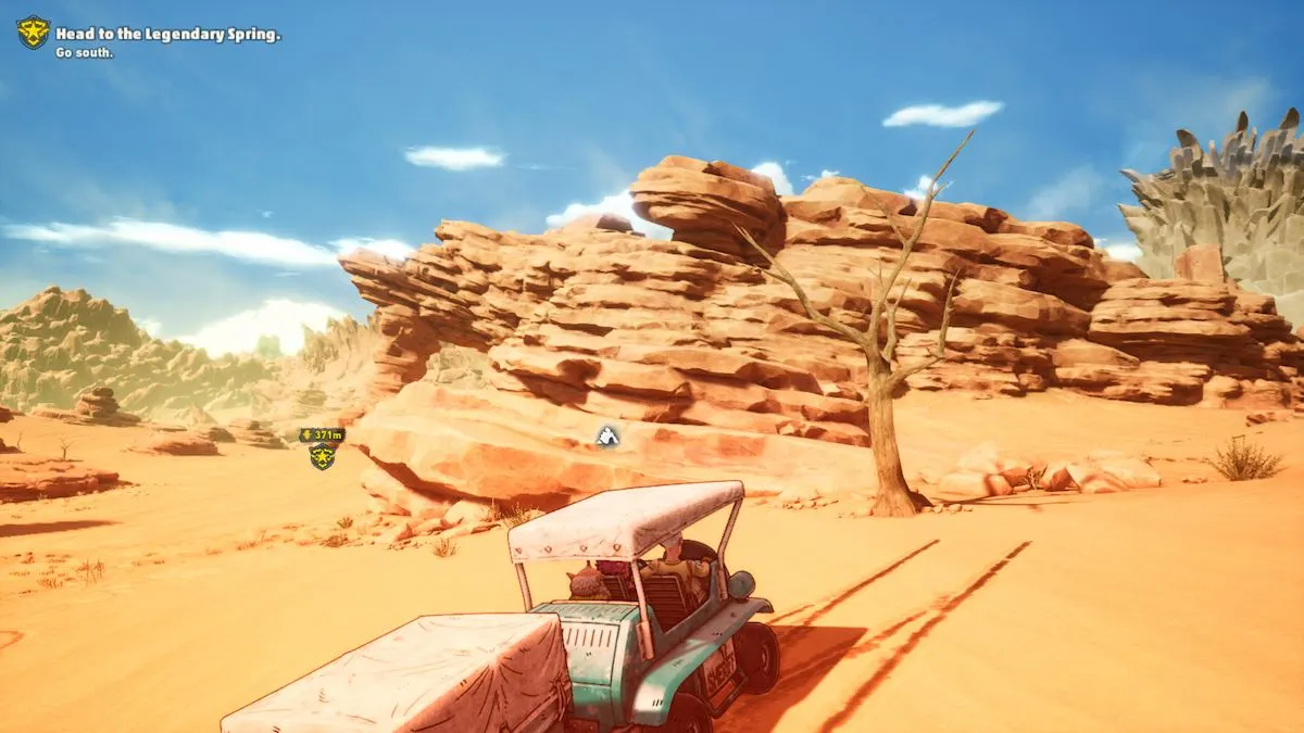 A screenshot of Sand Land gameplay showing a lone dead tree in the wastelands, with the player's vehicle parked next to it.
