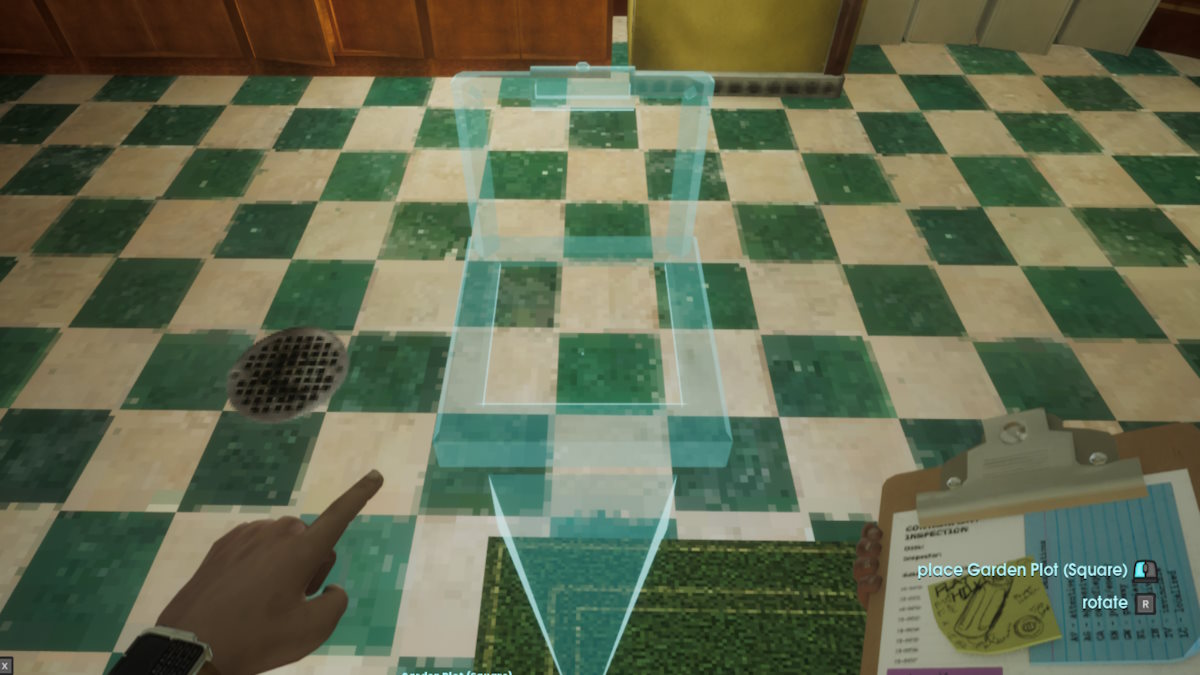 The blue outline of a garden plot being built on a tiled floor. 