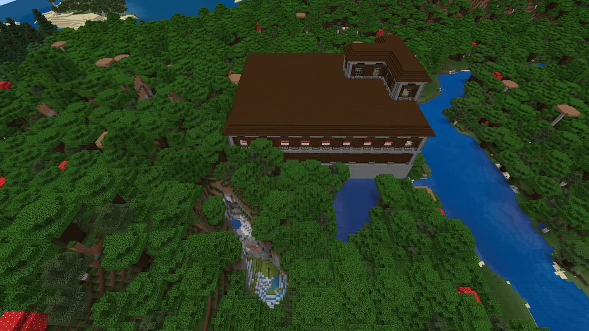 A Woodland Mansion next to a river and a ravine containing a Lush Cave