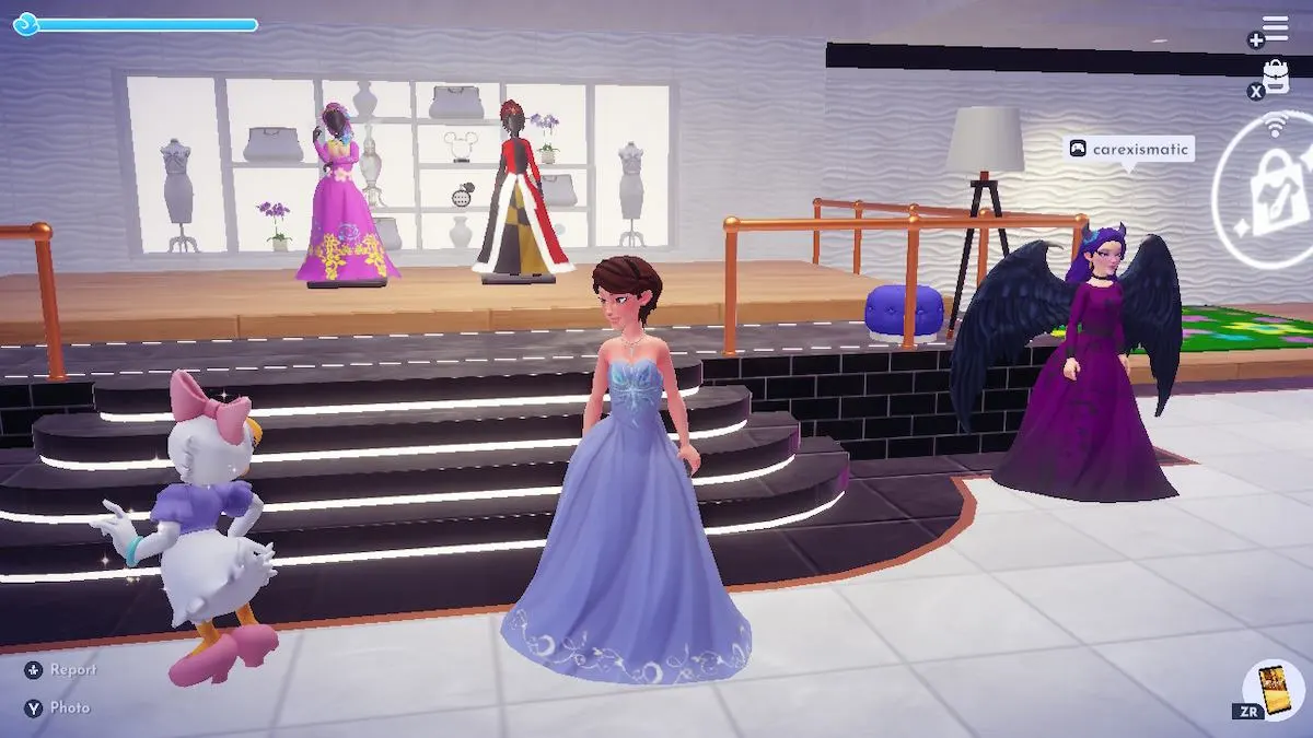 A fem-presenting Disney Dreamlight Valley avatar stands in front of the Challenge Area in another player's Boutique. Daisy is off to the left, with the valley owner on the right wearing a purple dress.