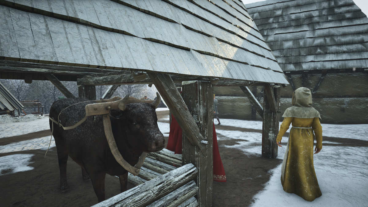 Ox resting in snow covered village in Manor Lords