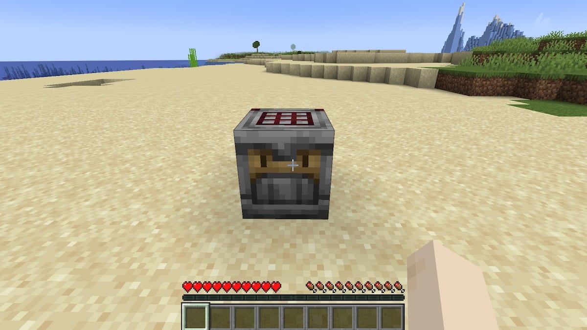 A placed Crafter block on a beach in Minecraft