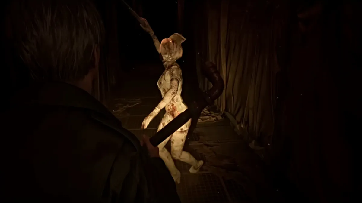James fights a Bubblehead Nurse in Silent Hill 2 remake