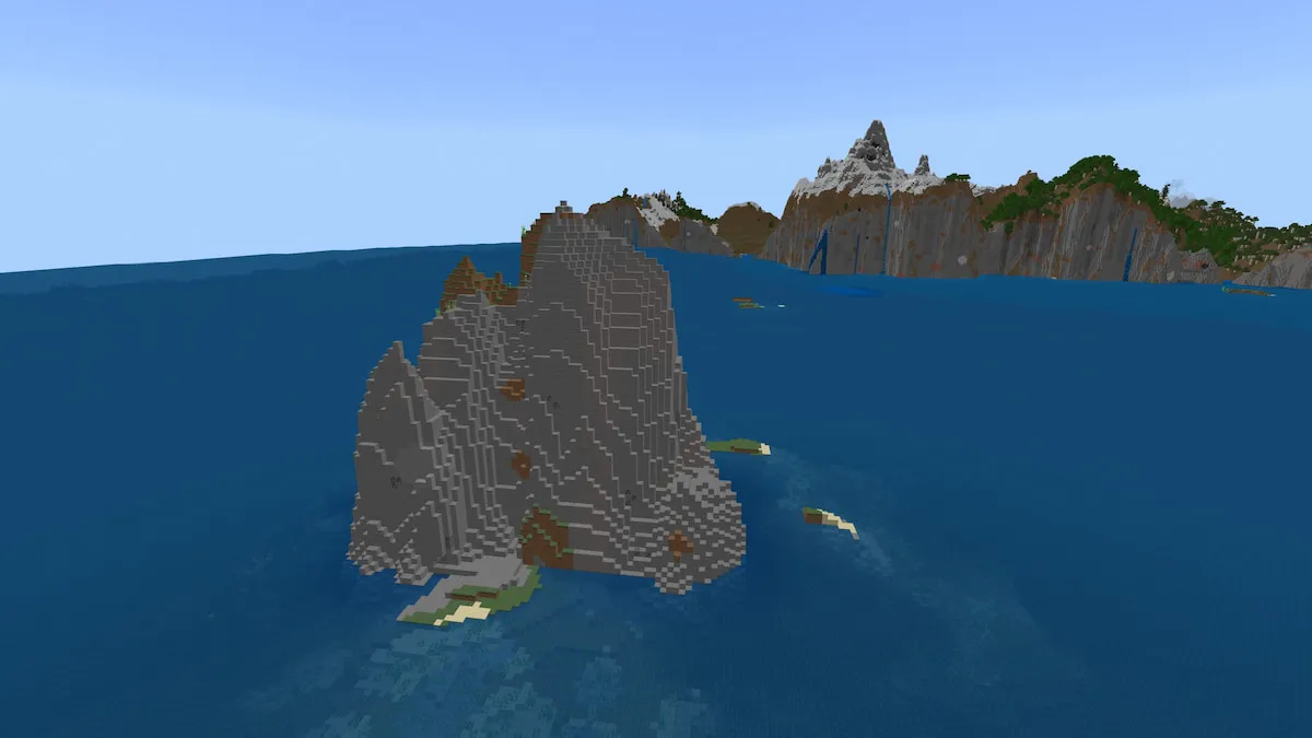 A tall Gravel Island in Minecraft in front of a large cliff coastline