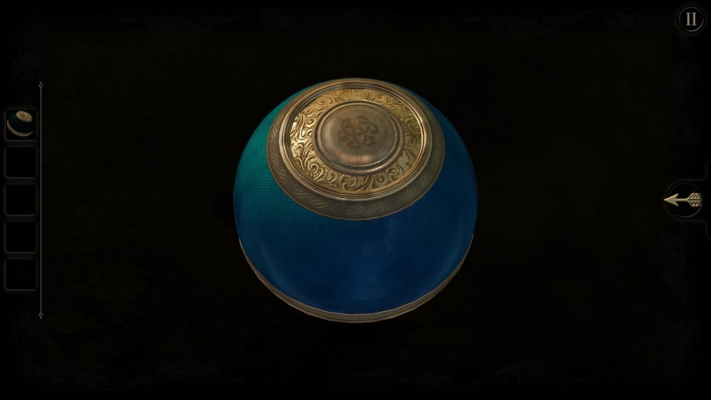 Rotating the top of the metal orb to find the button