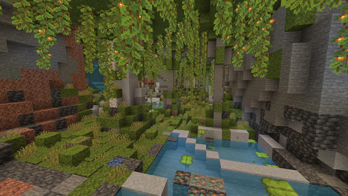 A small Minecraft Lush Cave with tropical fish and axolotls