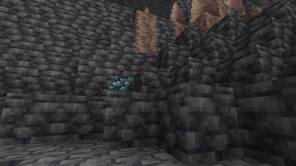 A diamond ore hiding behind Dripstone in Minecraft