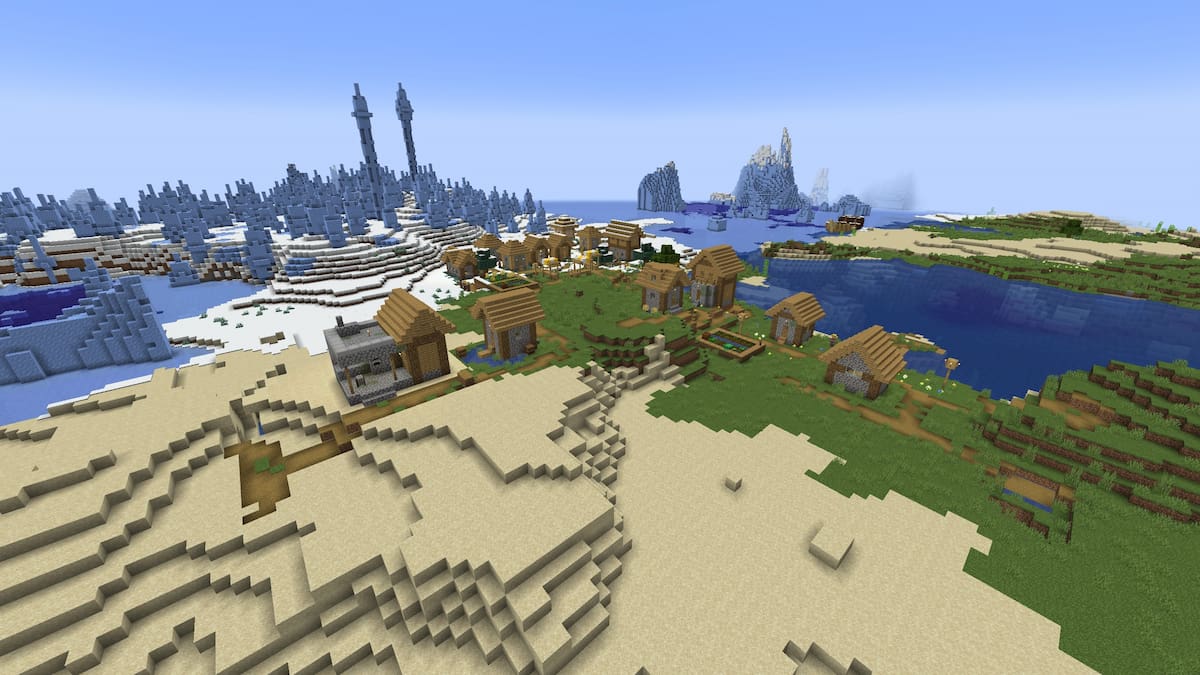 A Minecraft village split between a sandy Beach and a Snowy Beach biome