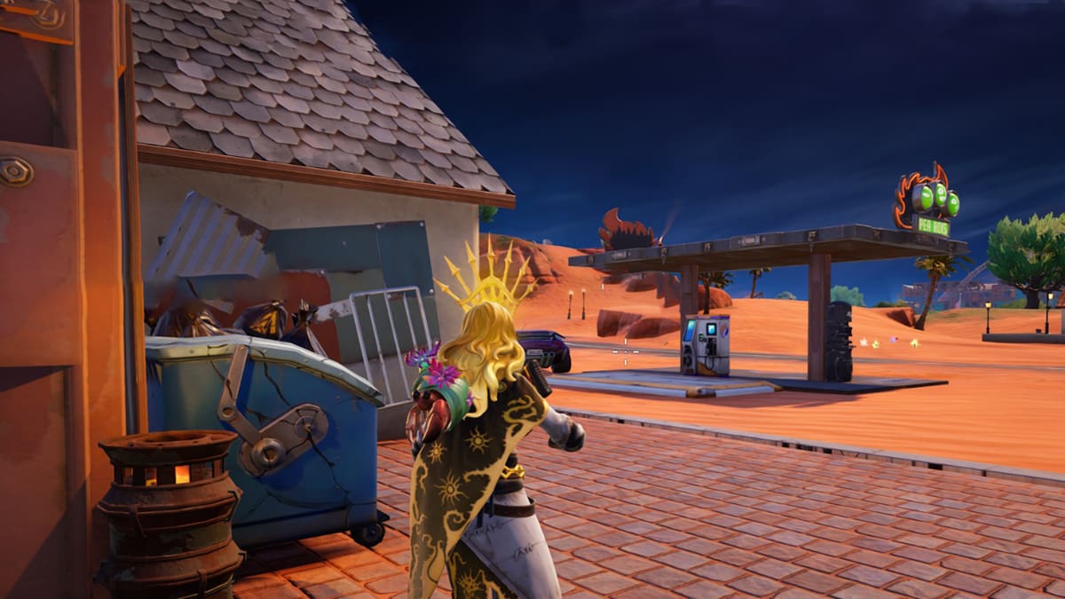 Fortnite character looking at a gas station