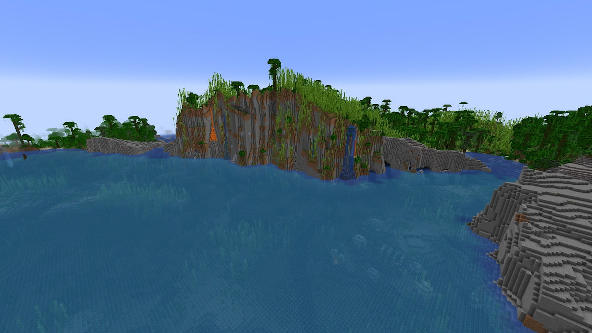 A tall Jungle cliff face above a Minecraft Warm Ocean