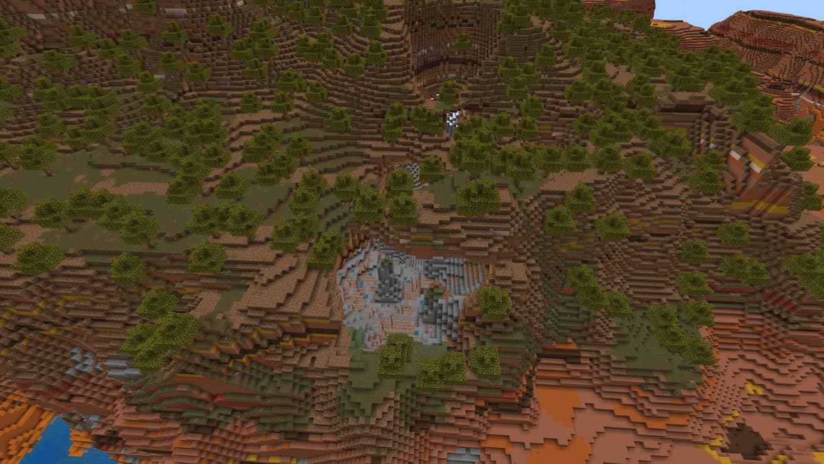 A Dripstone Cave carving out the center of a Minecraft Wooded Badlands mountain