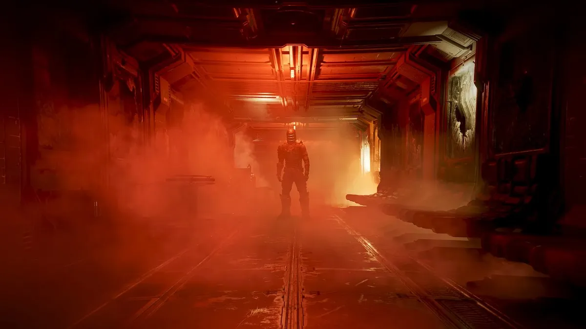 A man stands in the middle of a damaged corridor in the Dead Space remake.