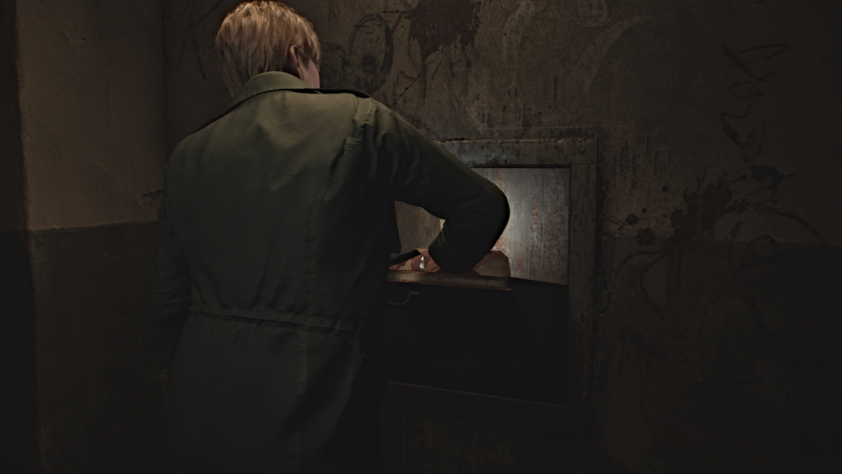 James putting Canned Juice in the chute in Silent Hill 2 Remake