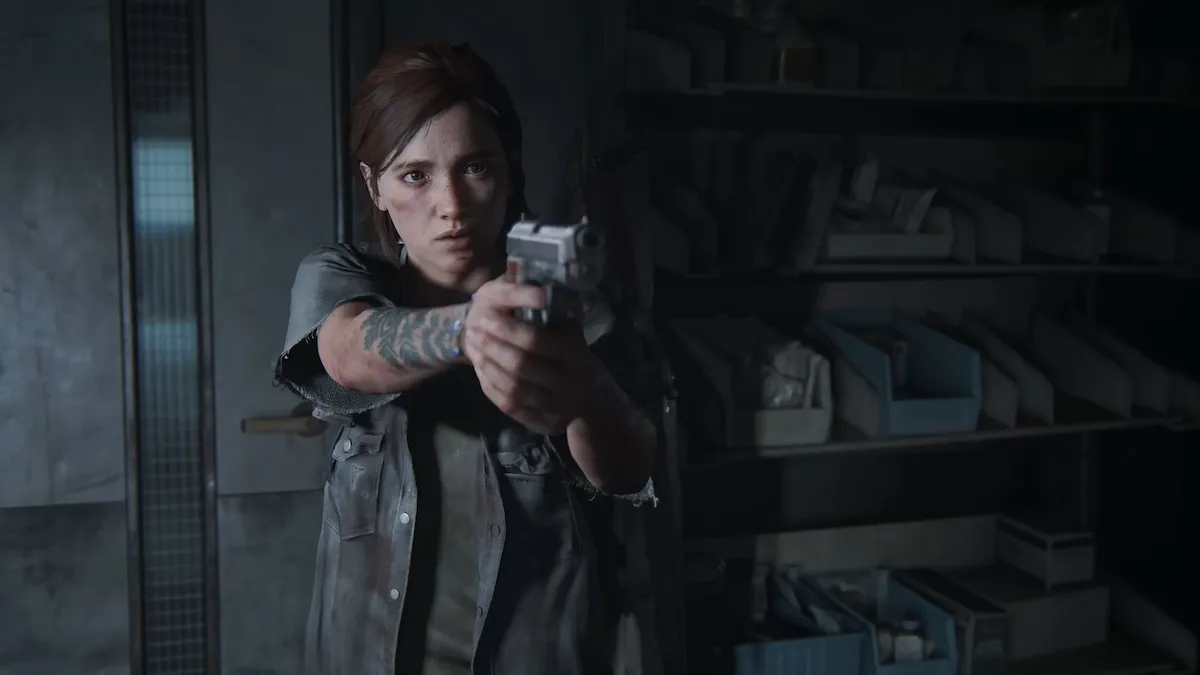 Ellie holding a gun in The Last of Us Part II.