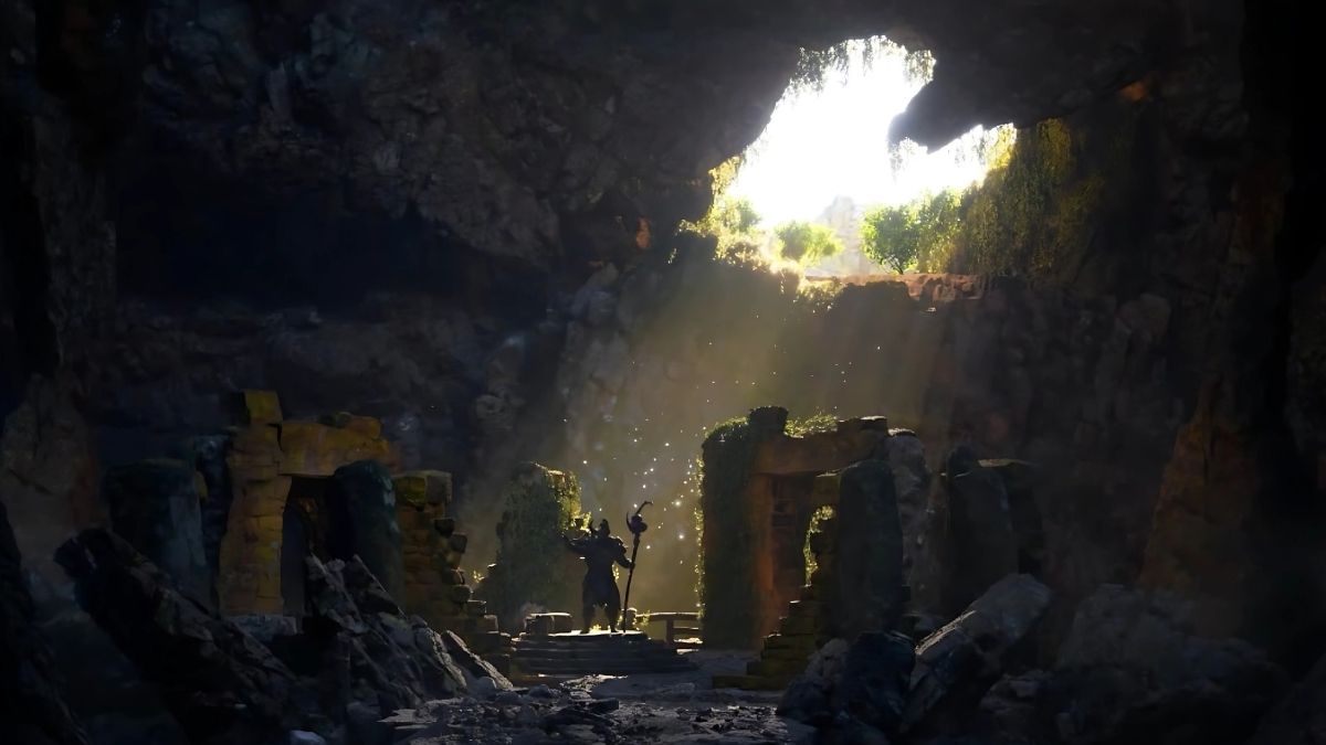 Merlin with Staff standing in a cave in King Arthur Legends Rise.