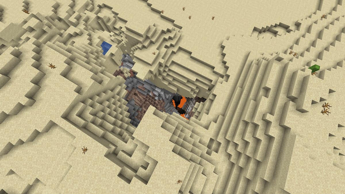 A cave in a Minecraft Desert leading straight down to a lava lake