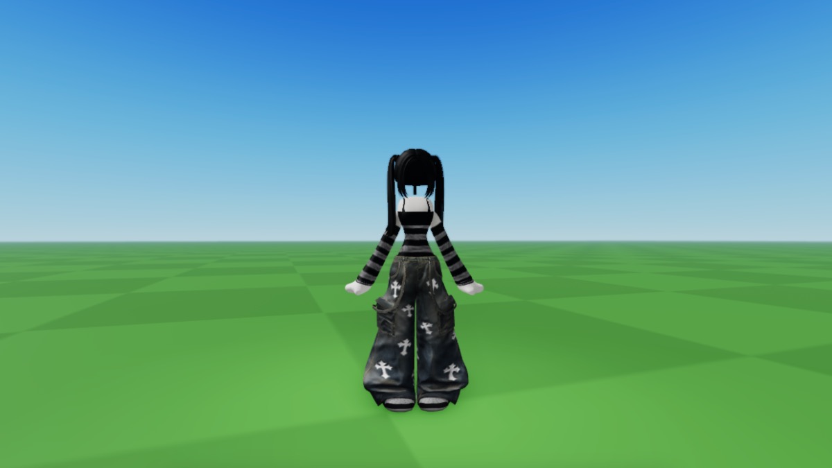 A Roblox avatar with black hair wearing a striped green and black long sleeves t-shirt and baggy jeans with 'Chrome Hearts' print.