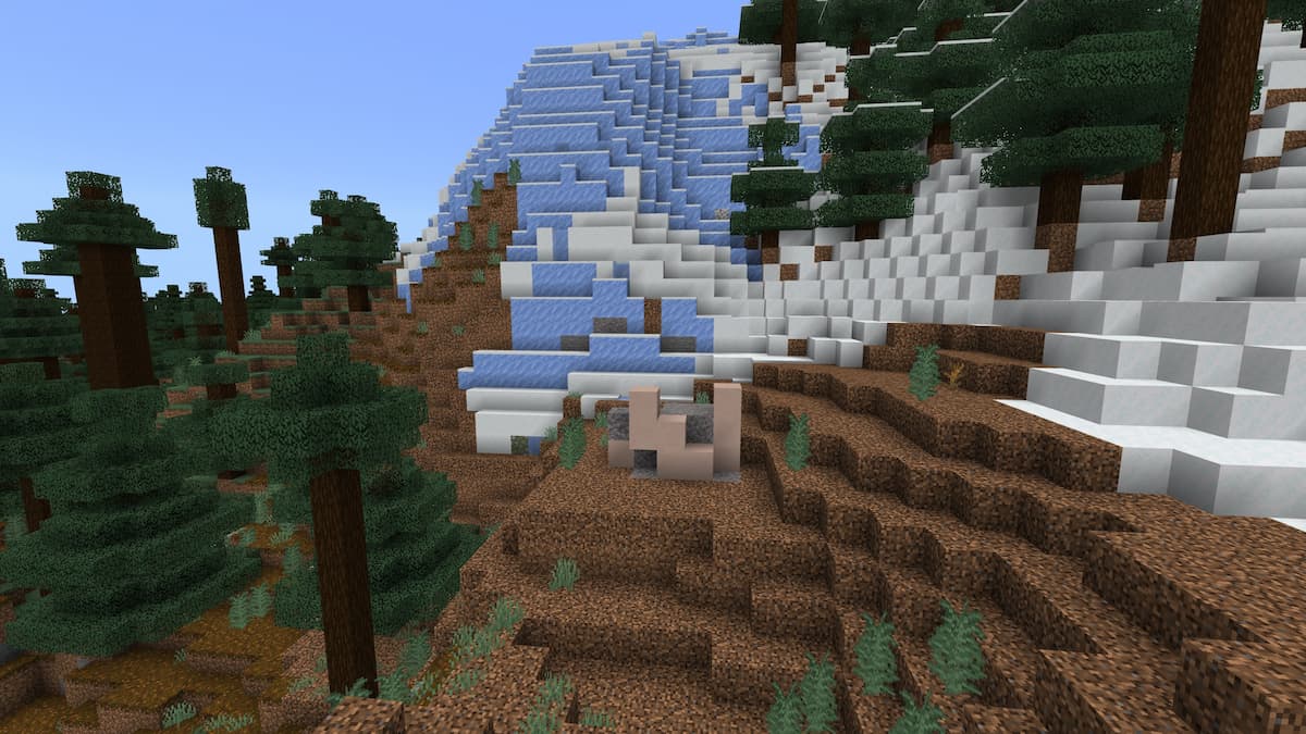 A set of Trail Ruins on an Old Growth Taiga biome with a Frozen Peaks mountain in Minecraft