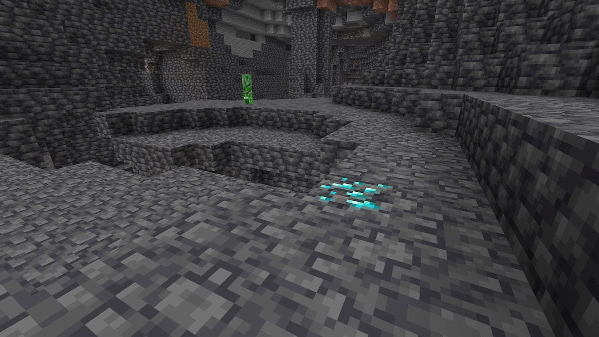 A Minecraft cave with a Creeper and some diamond ore